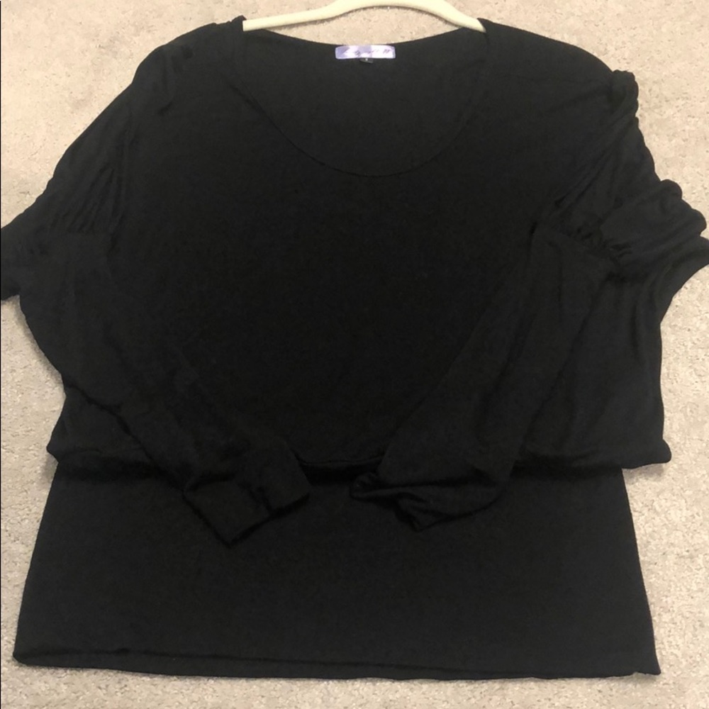 Tunic with sleeve detail and banded bottom.